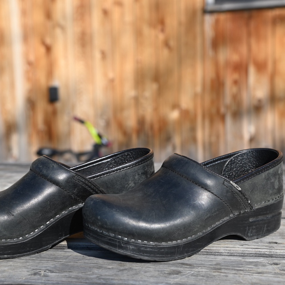 Dansko Black Leather Clogs with Slip-On Design